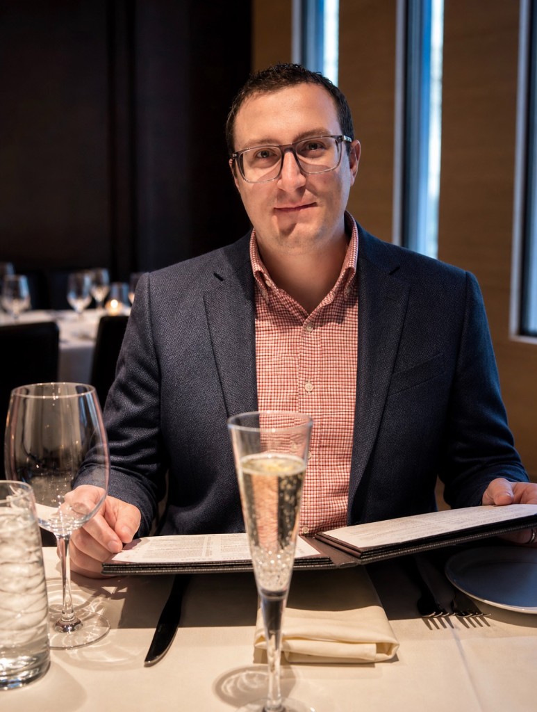 Adam at a fine-dining dinner